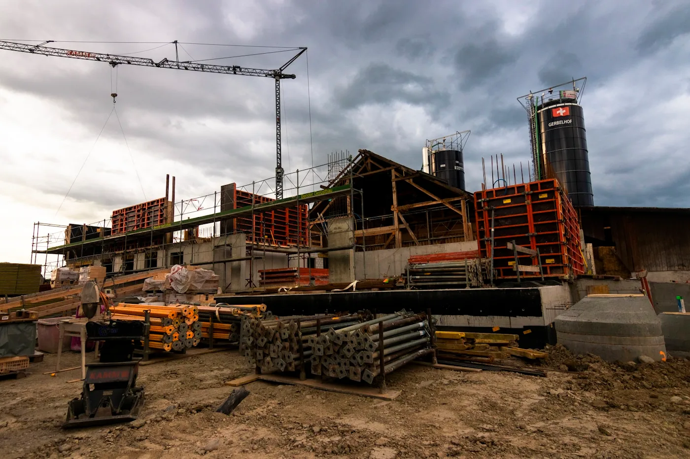 Construction site with a crane and building structures under development
